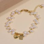 Lustrous white freshwater pearl double-strand bracelet with a gold heart