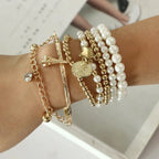 Vintage Gold Layered Pearl Charm Bracelet Stack - Six-Piece Set with Eiffel Tower and Coin Charms eprolo