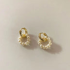 Classic gold-tone huggie hoops with baroque freshwater pearl dangles flat lay