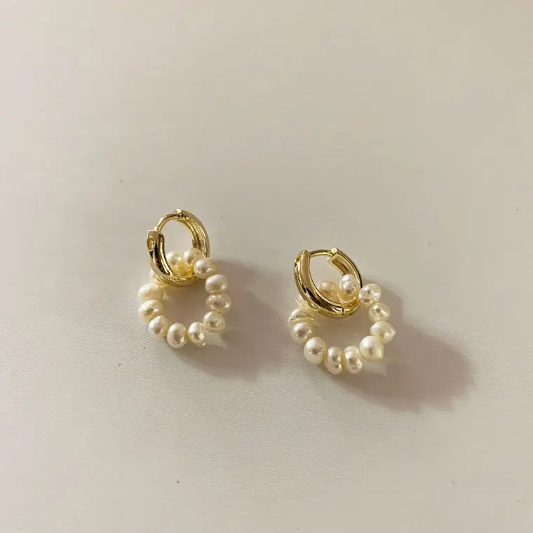 Classic gold-tone huggie hoops with baroque freshwater pearl dangles flat lay
