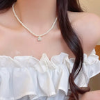Choker pearl necklace with a square-cut rhinestone pendant