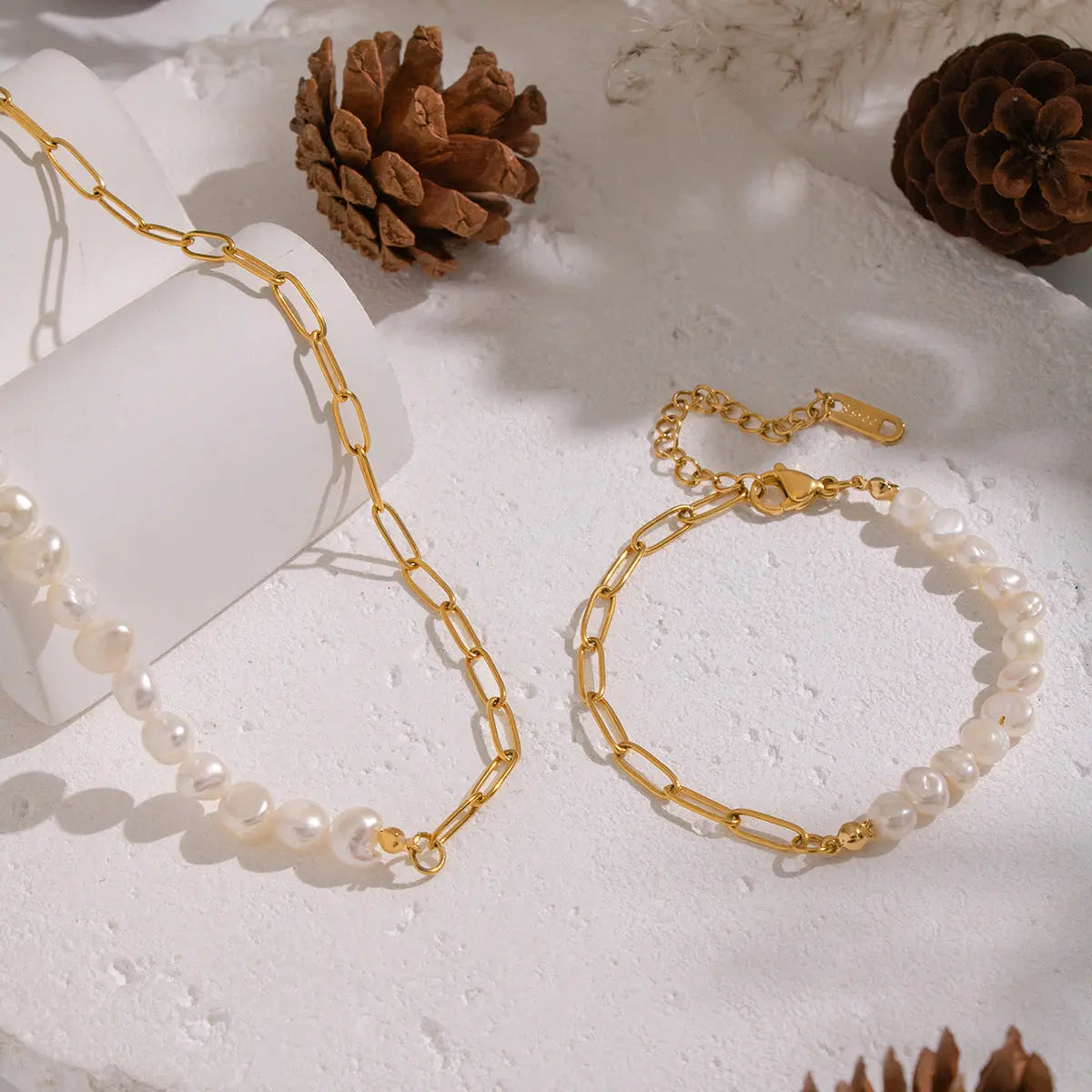 Gold Plated Paperclip Chain and Pearl Necklace and Bracelet Set on Stone