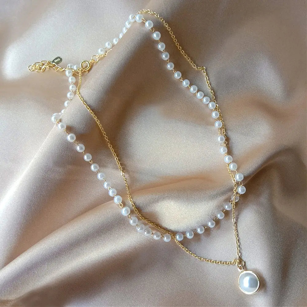 Close up of gold double layer pearl choker with S925 tag on satin