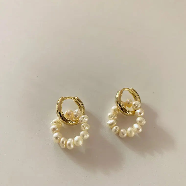 Natural freshwater pearl hoop earrings in gold flat lay