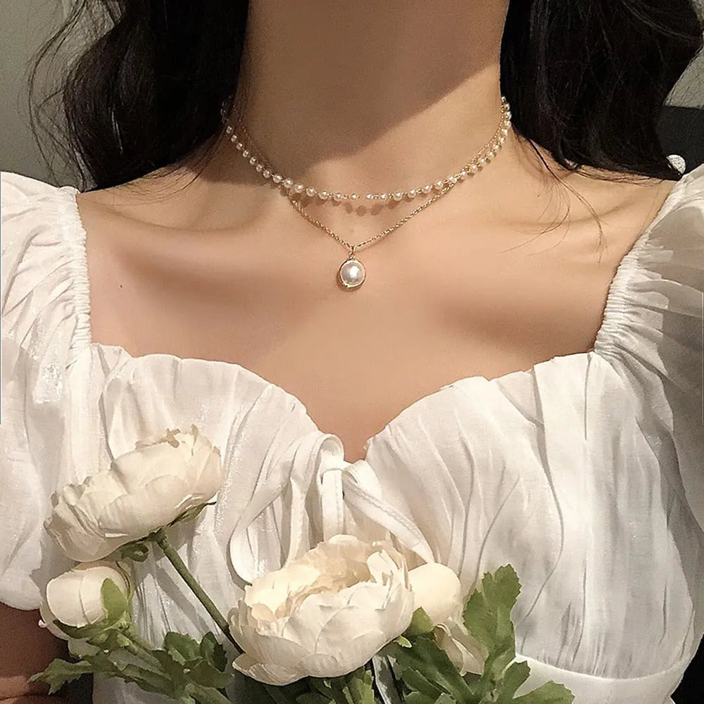 Double layer gold pearl choker necklace on model