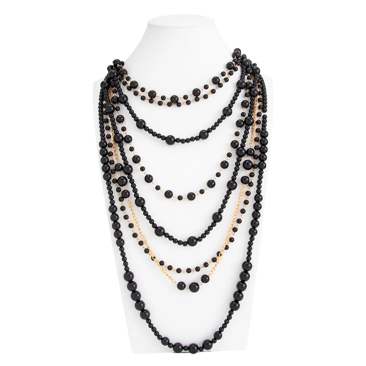 Pearl Layered Statement Body Chain in black and gold displayed on a white mannequin torso