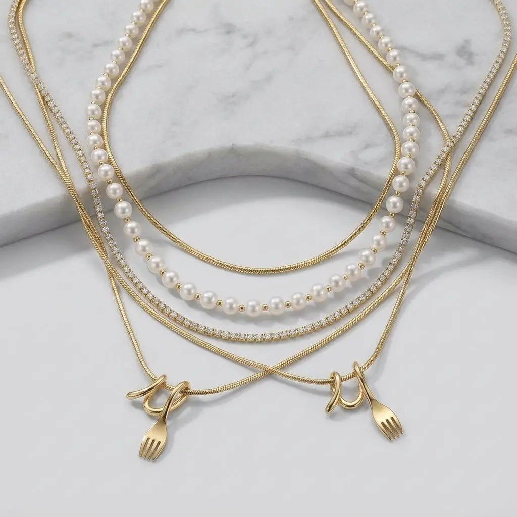 Layered Pearl Pendant Necklace on elegant marble studio background