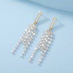 Style E0120 Elegant Crystal Cascade Earring on a light blue studio background