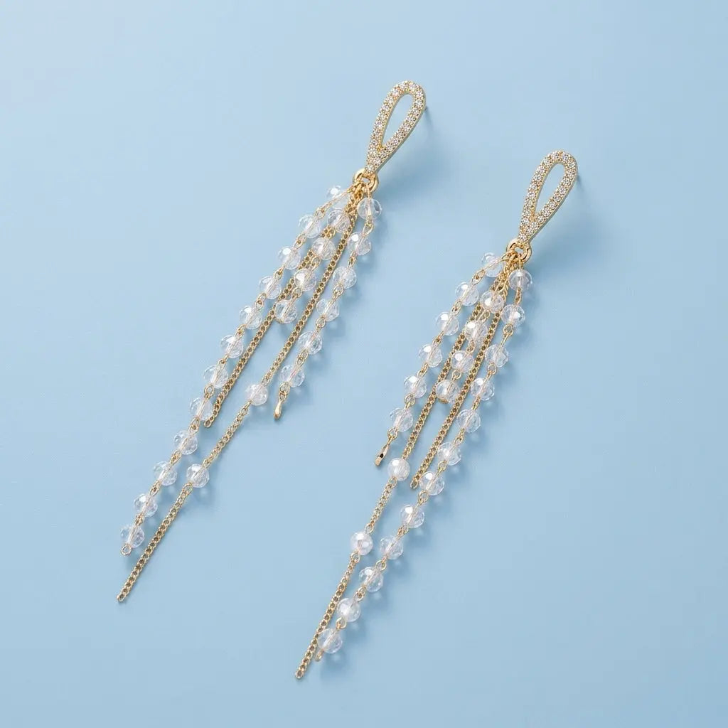 Style E0124 Crystal-Encrusted Drop Tassel Earring on a light blue studio background