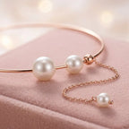 Close-up detail of Asymmetric Pearl Tassel Collar Necklace and pearls