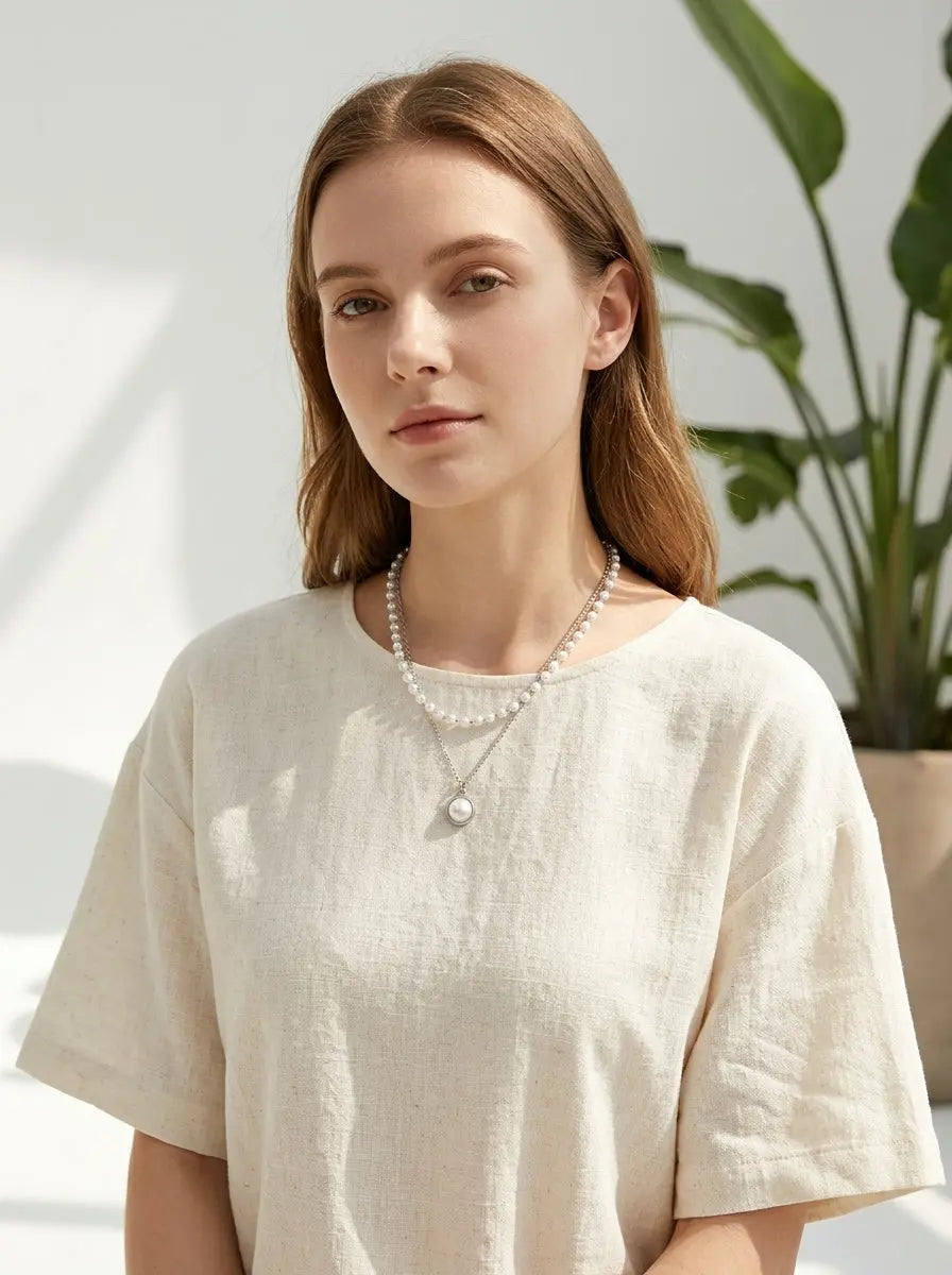 Elegant model wearing Double Layer Pearl Pendant Necklace
