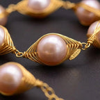 Macro Close-Up Detail of Handmade Pink Pearl Gold Wire Cage Bracelet